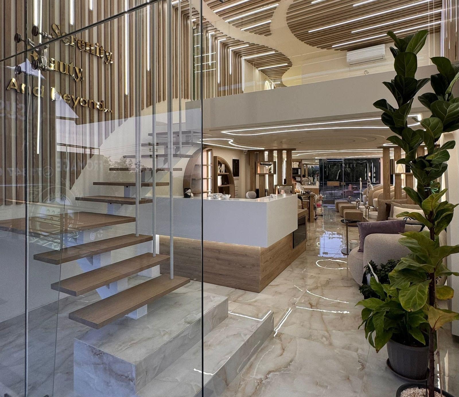 The marble staircase and glass entrance of Oshun Beauty Spa in Ballouneh